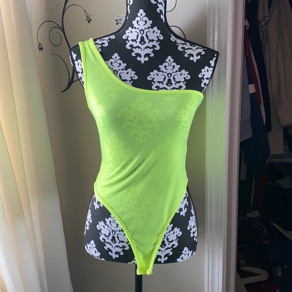 Lime green one shoulder bodysuit. Never worn new with tags. Size M